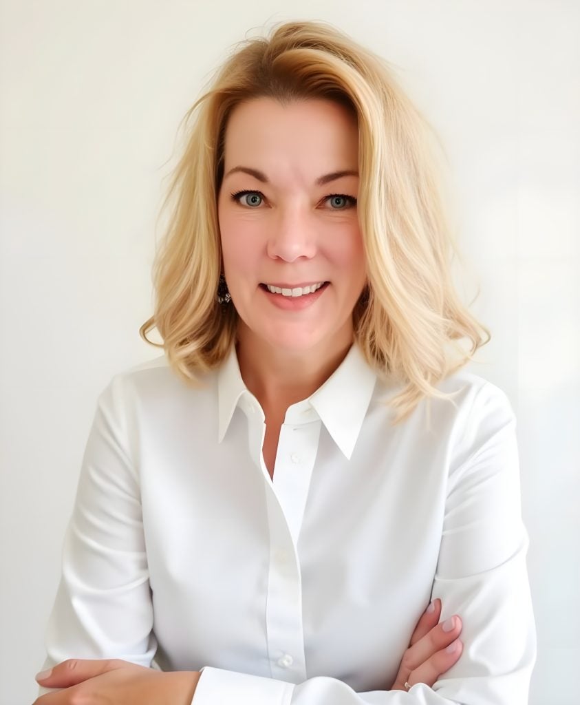 Debra Whitson, founder of Mediated Online Solutions, LLC, smiling in a white collared shirt against a light background
